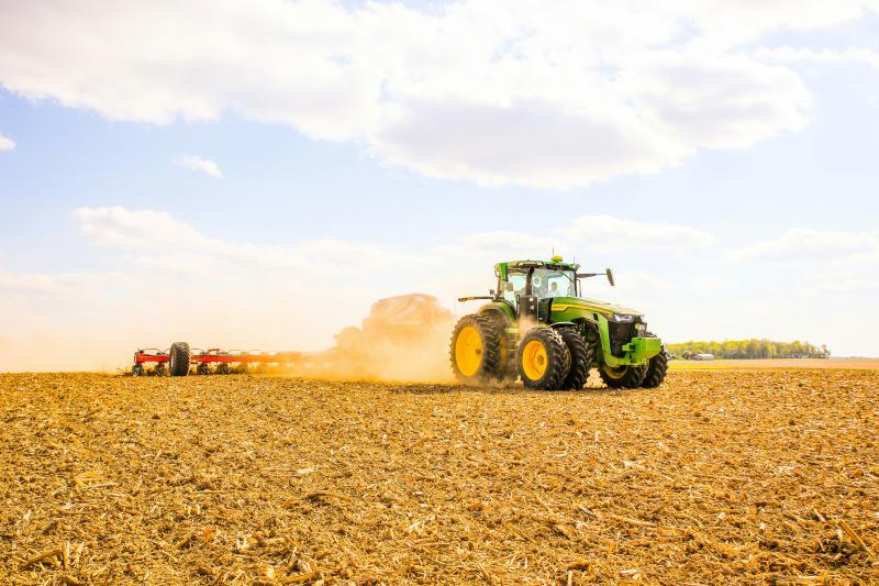 Photo by Hannah Shedrow on Unsplash Tractor ploughing field